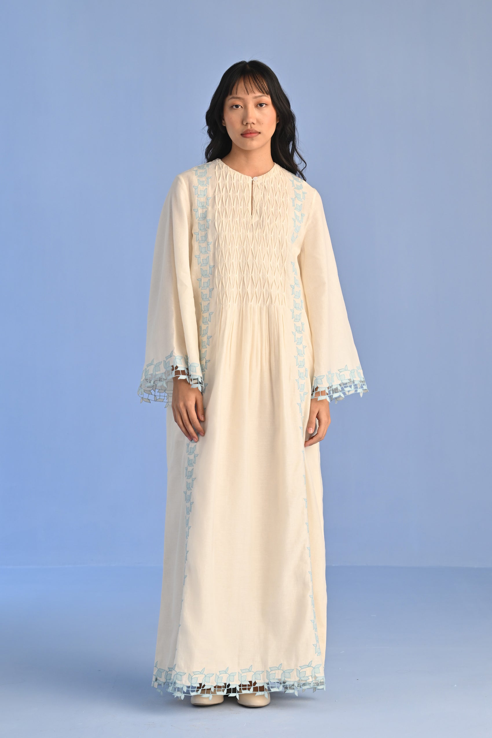 PLEATED DRESS WITH CUTWORK