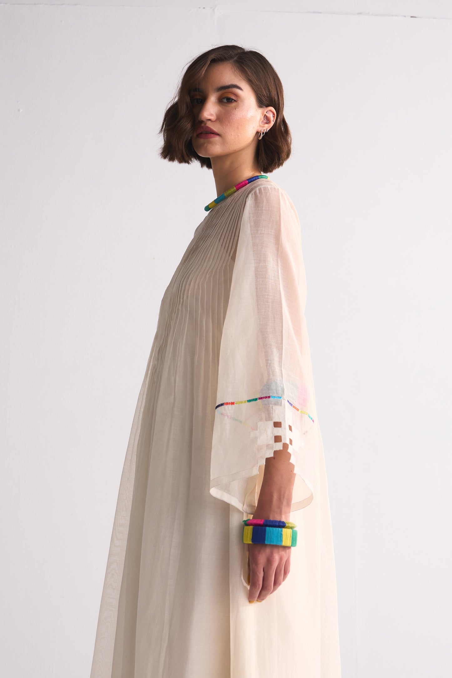 SUPER PLEATED DRESS WITH APPLIQUE', CUTWORK AND THREAD