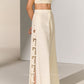 GEOMETRIC FLORAL CUTWORK SIDE PLEATED PANTS
