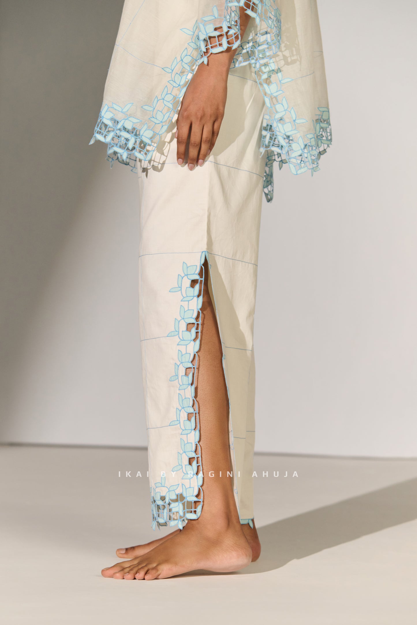 GEOMETRIC FLORAL CUTWORK HIGH SLIT PANTS