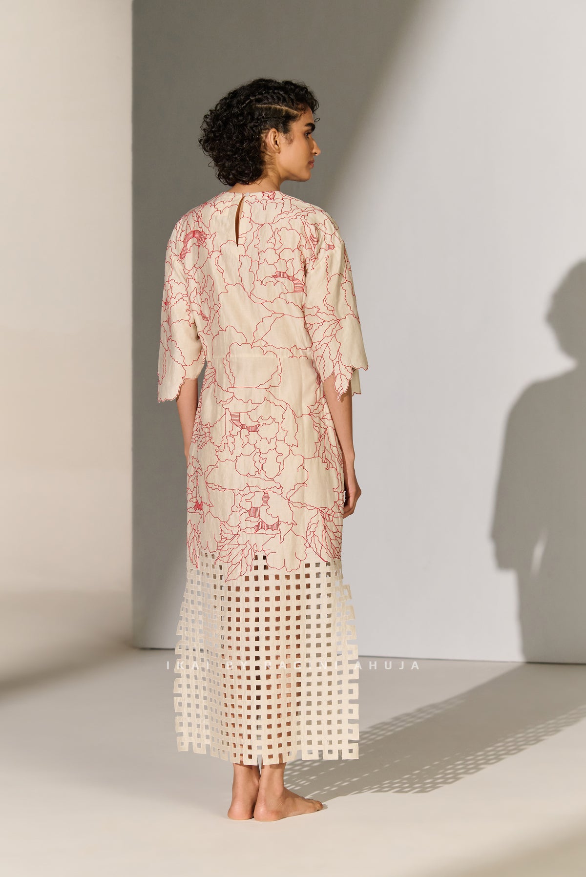 CINCHED WAIST DRESS WITH GEOMETRIC FLORAL CUTWORK
