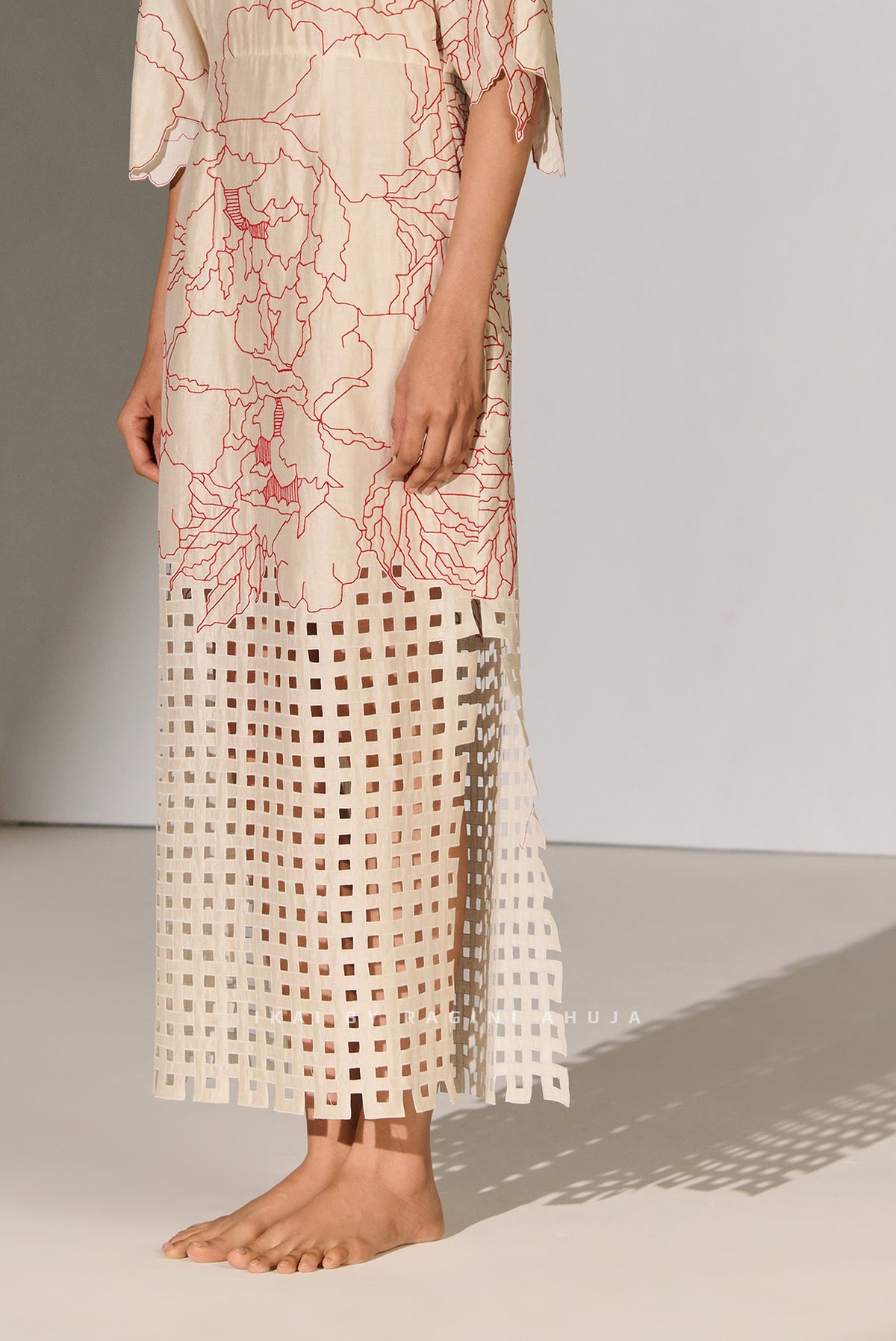 CINCHED WAIST DRESS WITH GEOMETRIC FLORAL CUTWORK