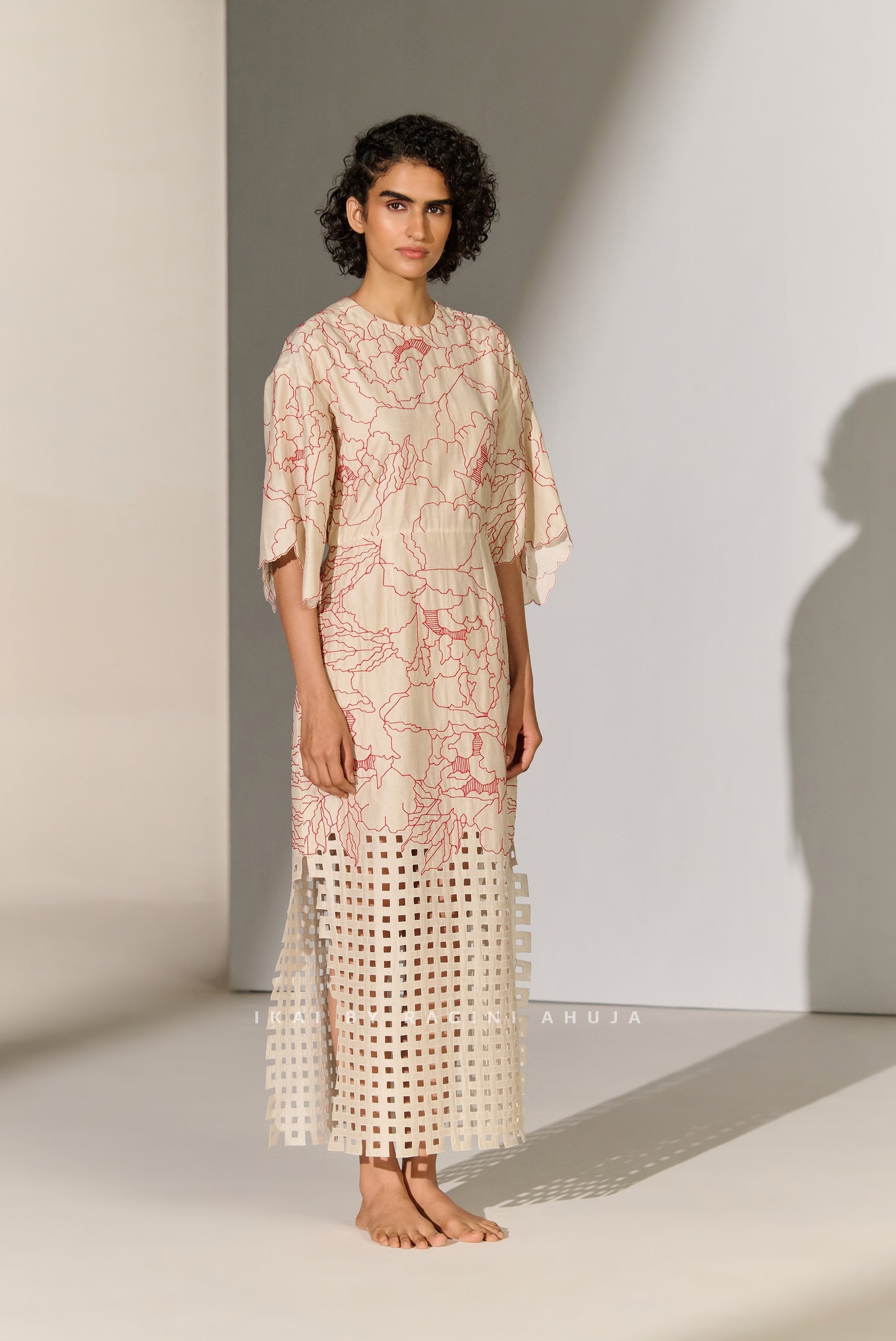 CINCHED WAIST DRESS WITH GEOMETRIC FLORAL CUTWORK