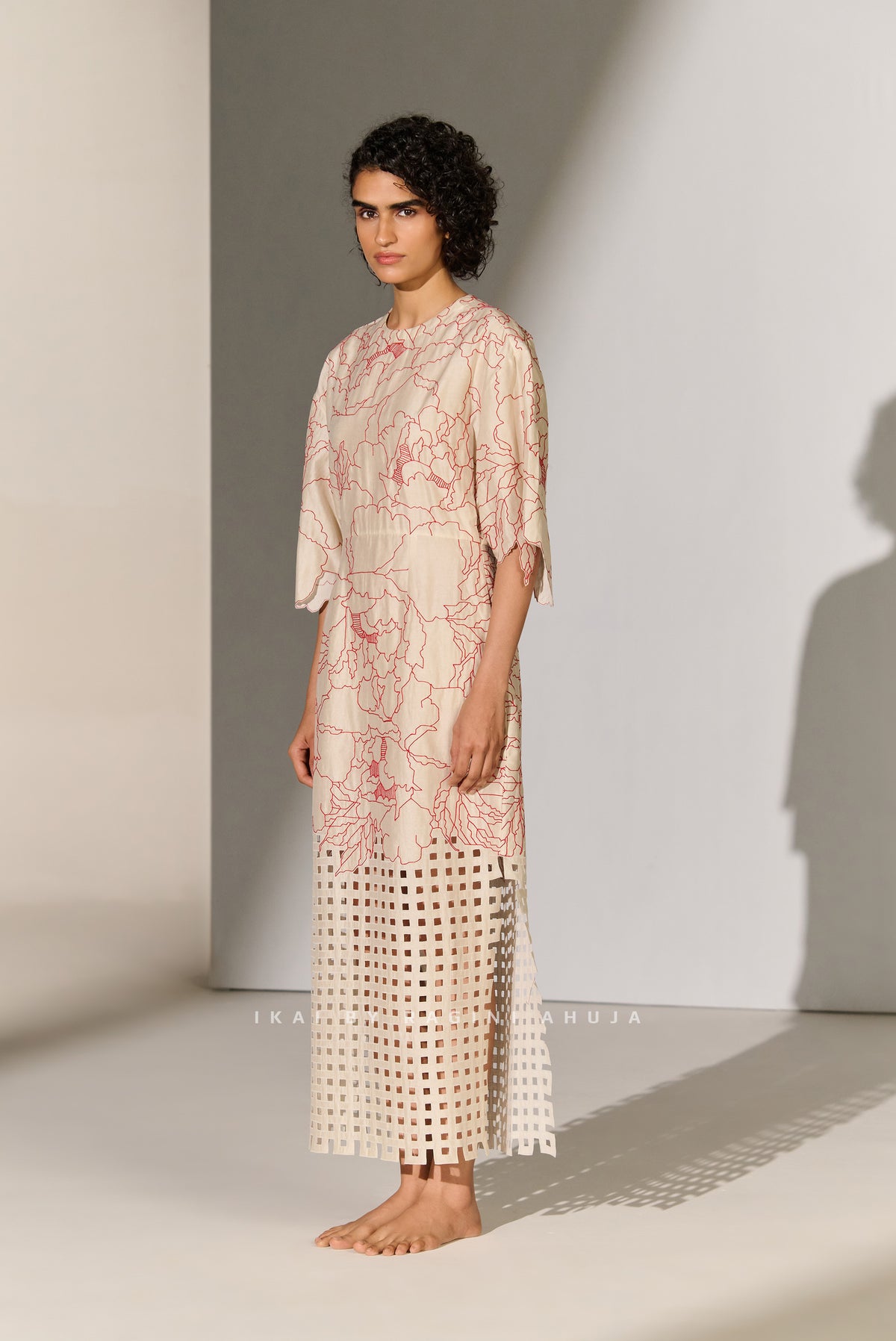 CINCHED WAIST DRESS WITH GEOMETRIC FLORAL CUTWORK